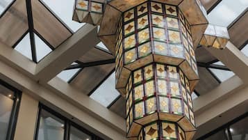 A geometric ceiling structure with a central light fixture.