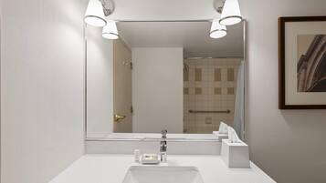 Suite, 1 King Bed, Non Smoking | Bathroom | Separate tub and shower, hair dryer, towels