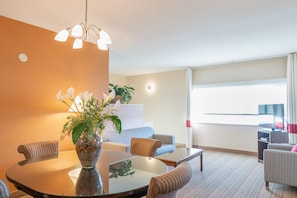 Executive Suite, 1 King Bed, Non Smoking | Living area | 32-inch TV with cable channels, DVD player