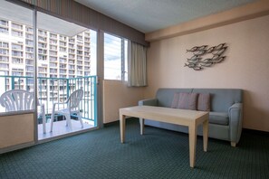 Deluxe Room | Living area | 40-inch LCD TV with cable channels, TV, DVD player