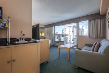 Deluxe Room | Living area | 40-inch LCD TV with cable channels, TV, DVD player at Aqua Aloha Surf Waikiki