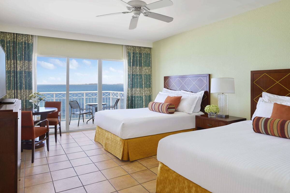Garden Room Water View | Hypo-allergenic bedding available, in-room safe, blackout drapes