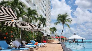 Outdoor pool, open 7:00 AM to 10:00 PM, pool umbrellas, pool loungers