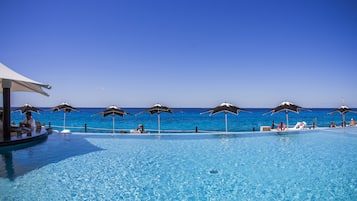 Outdoor pool, open 7:00 AM to 10:00 PM, pool umbrellas, sun loungers