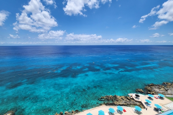 Beach nearby, white sand, sun loungers, beach umbrellas