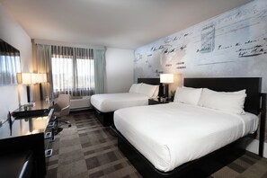 Premium bedding, desk, laptop workspace, blackout drapes