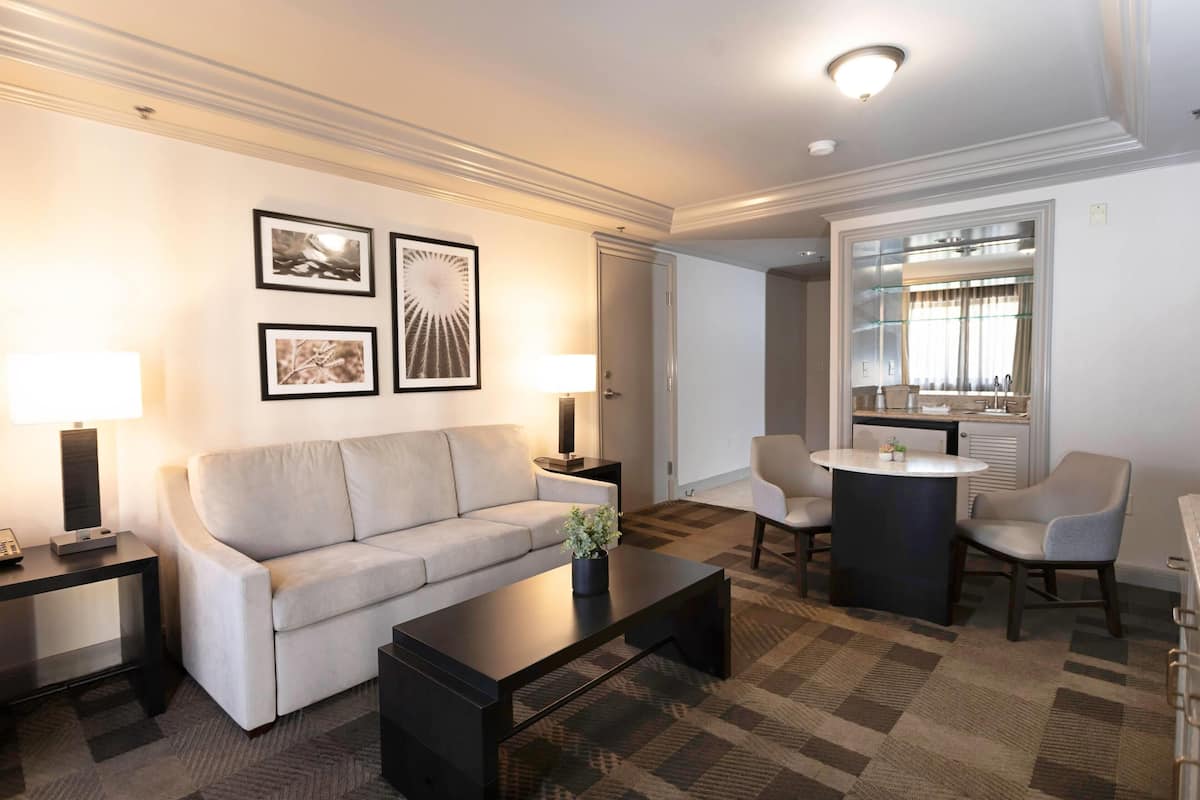 Premium bedding, desk, laptop workspace, blackout drapes