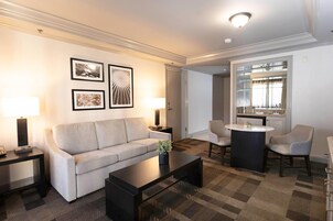 Premium bedding, desk, laptop workspace, blackout drapes