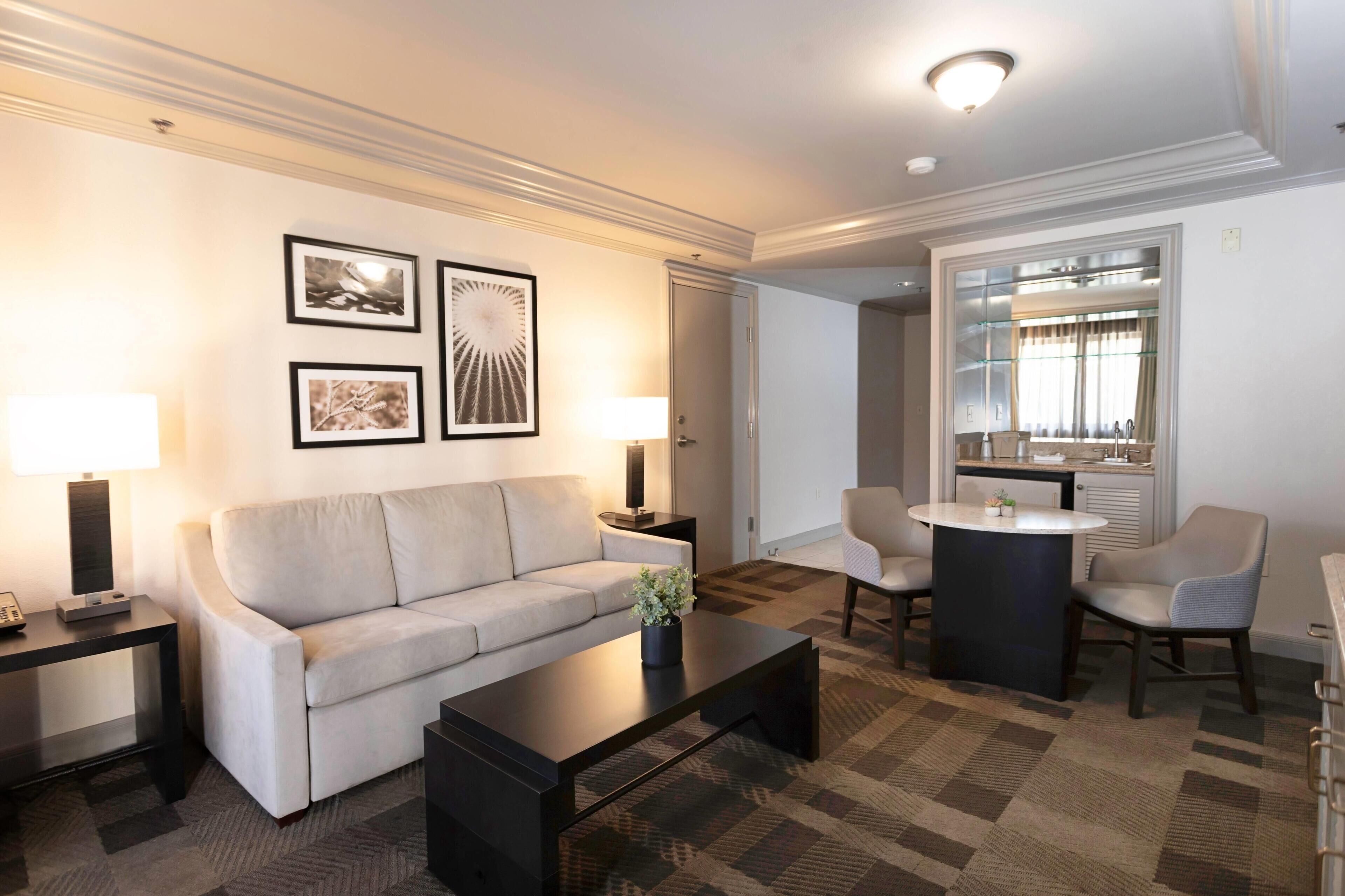 Premium bedding, desk, laptop workspace, blackout drapes