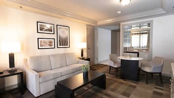 Premium bedding, desk, laptop workspace, blackout drapes