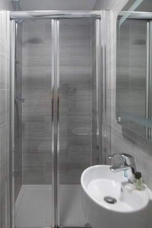 Shower, free toiletries, hair dryer, towels