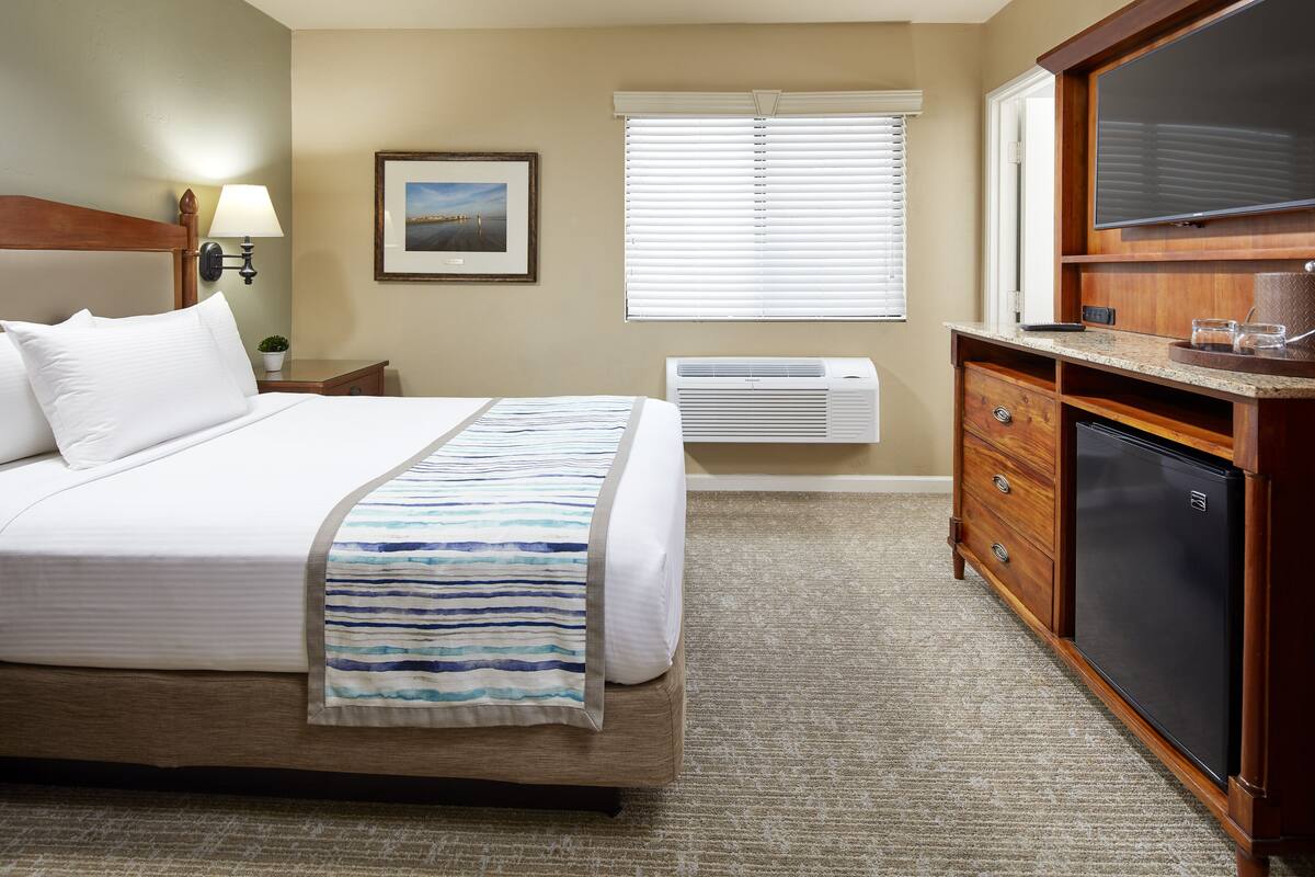 Premium bedding, desk, laptop workspace, iron/ironing board