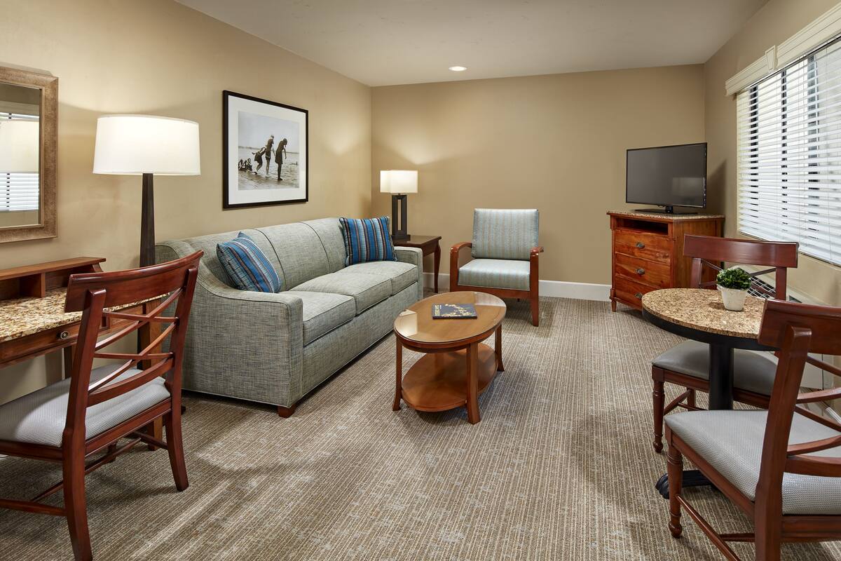 Premium bedding, desk, laptop workspace, iron/ironing board