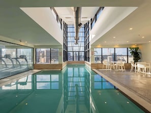 Indoor pool, open 6:30 AM to 10:00 PM, pool loungers