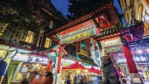 A traditional Chinese building with ornate architecture, including a red roof and intricate designs. - Mercure Sydney (Chippendale)