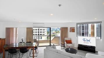 Three Bedroom Apartment | Living area | 32-inch flat-screen TV with satellite channels, TV, DVD player