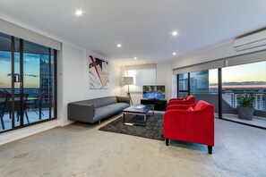 Swiss-SuperSuite Three Bedroom | Living area | Flat-screen TV, DVD player, pay films