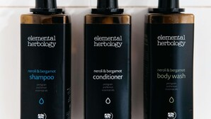 Three Elemental Herbology products: shampoo, conditioner, and body wash. - Mercure Sydney Parramatta (Rosehill)