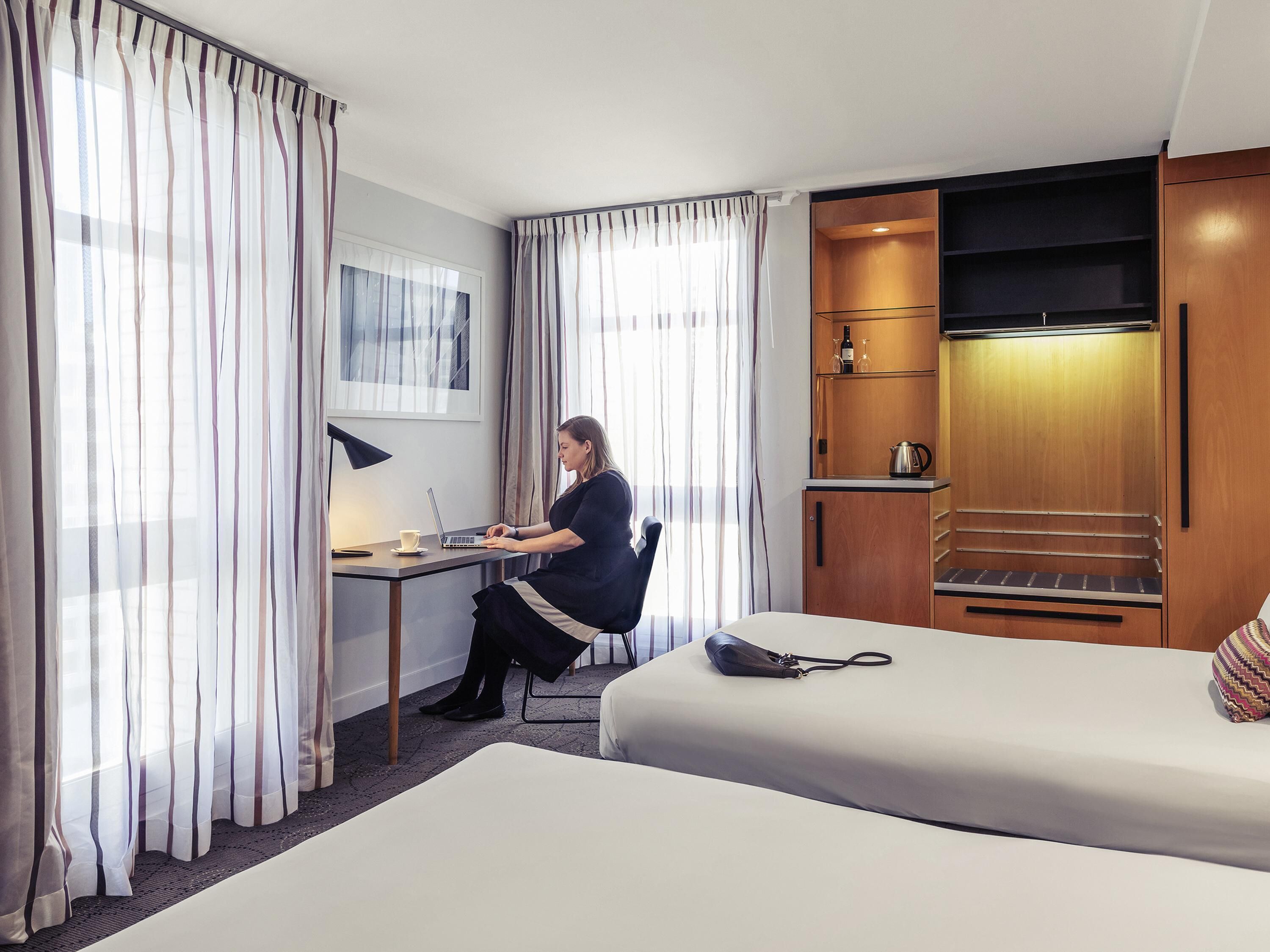 Deluxe Room, 2 Queen Beds, Corner | In-room safe, desk, blackout drapes, soundproofing