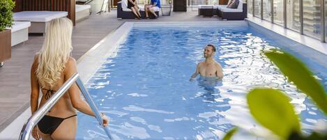 Outdoor pool, open 5:00 AM to 7:00 PM, pool loungers