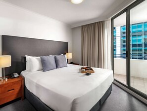 Standard Apartment, 1 Bedroom | Minibar, desk, laptop workspace, blackout drapes
