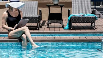 Outdoor pool, open 7:00 AM to 9:00 PM, sun loungers