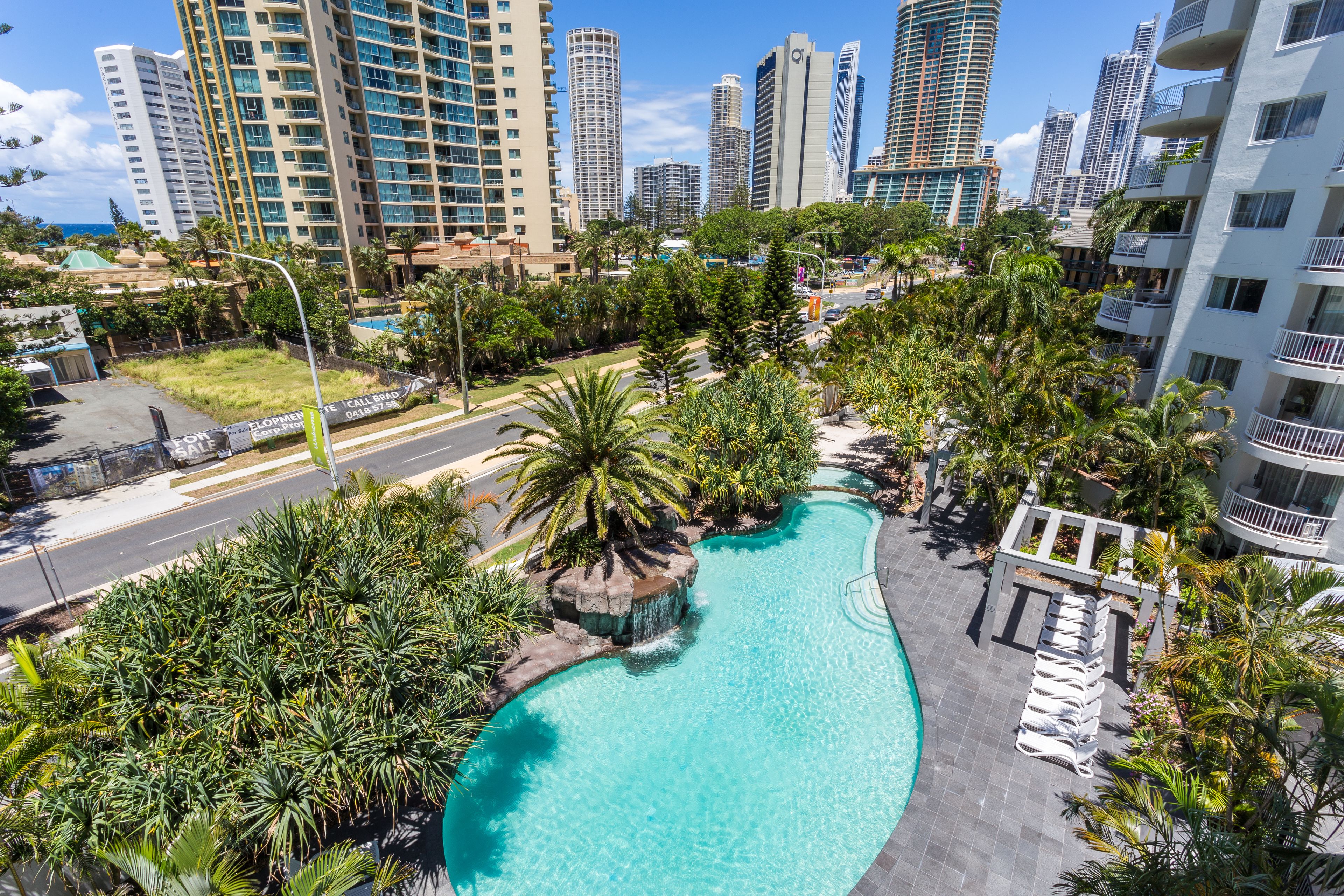 Outdoor pool, open 7:00 AM to 9:00 PM, pool loungers
