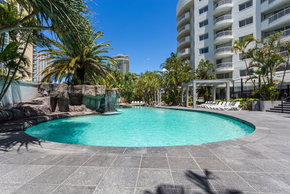 Outdoor pool, open 7:00 AM to 9:00 PM, pool loungers