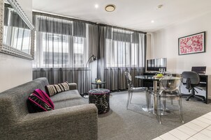One Bedroom Apartment | Living area | 32-inch LCD TV with satellite channels, TV