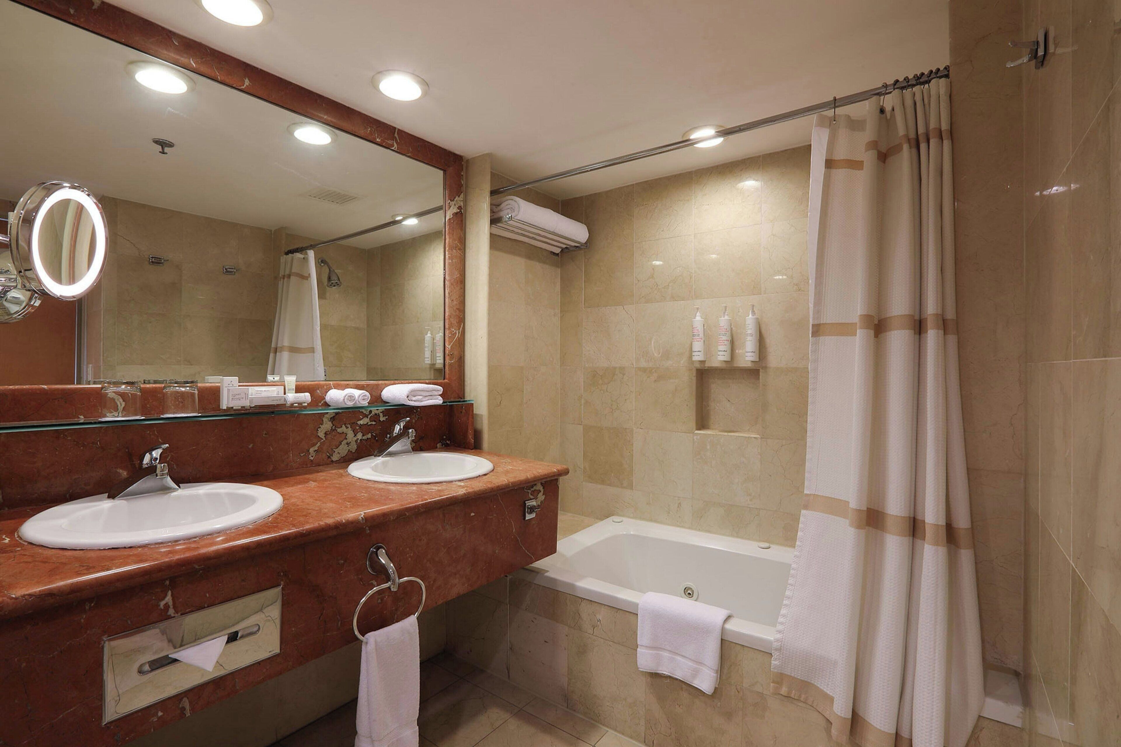 combined shower/bathtub, deep-soaking bathtub, free toiletries