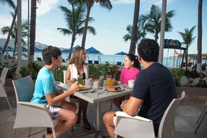 Breakfast, lunch, dinner served; beach views