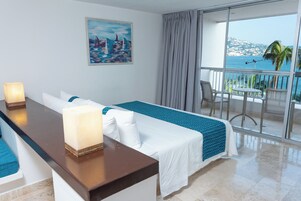Studio Suite, 1 King Bed, Partial Sea View | In-room safe, desk, laptop workspace, blackout drapes