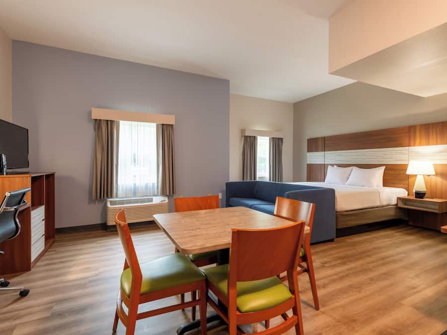 Premium bedding, desk, laptop workspace, iron/ironing board