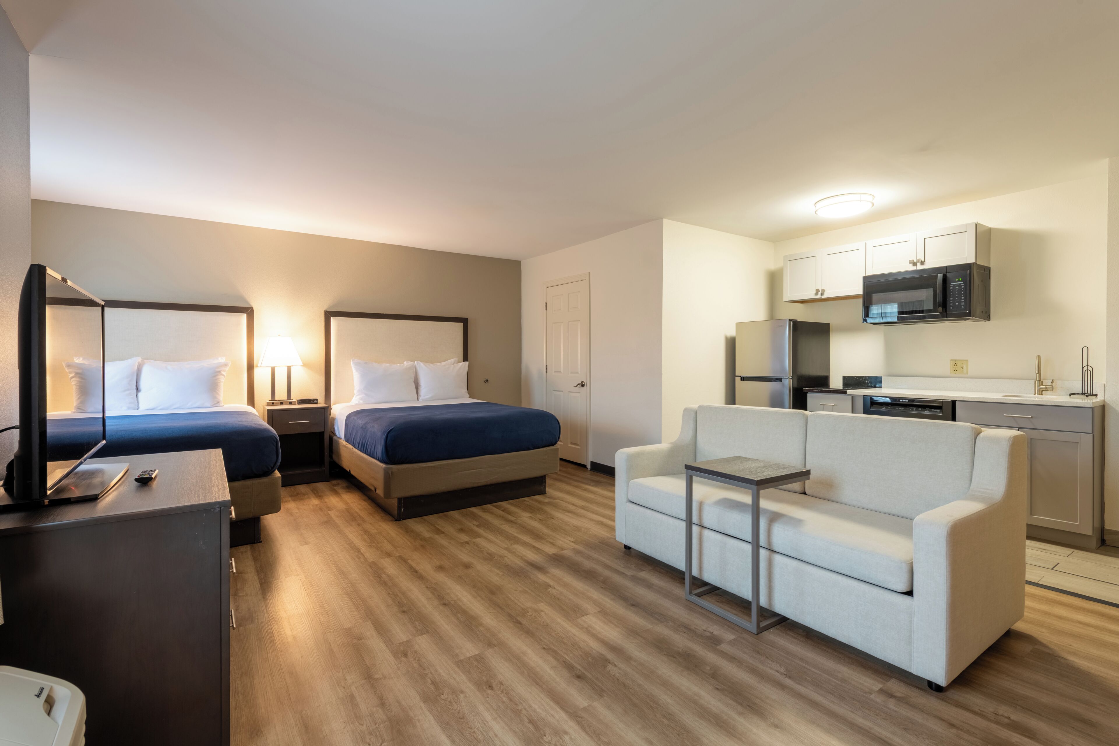 Premium bedding, desk, laptop workspace, iron/ironing board