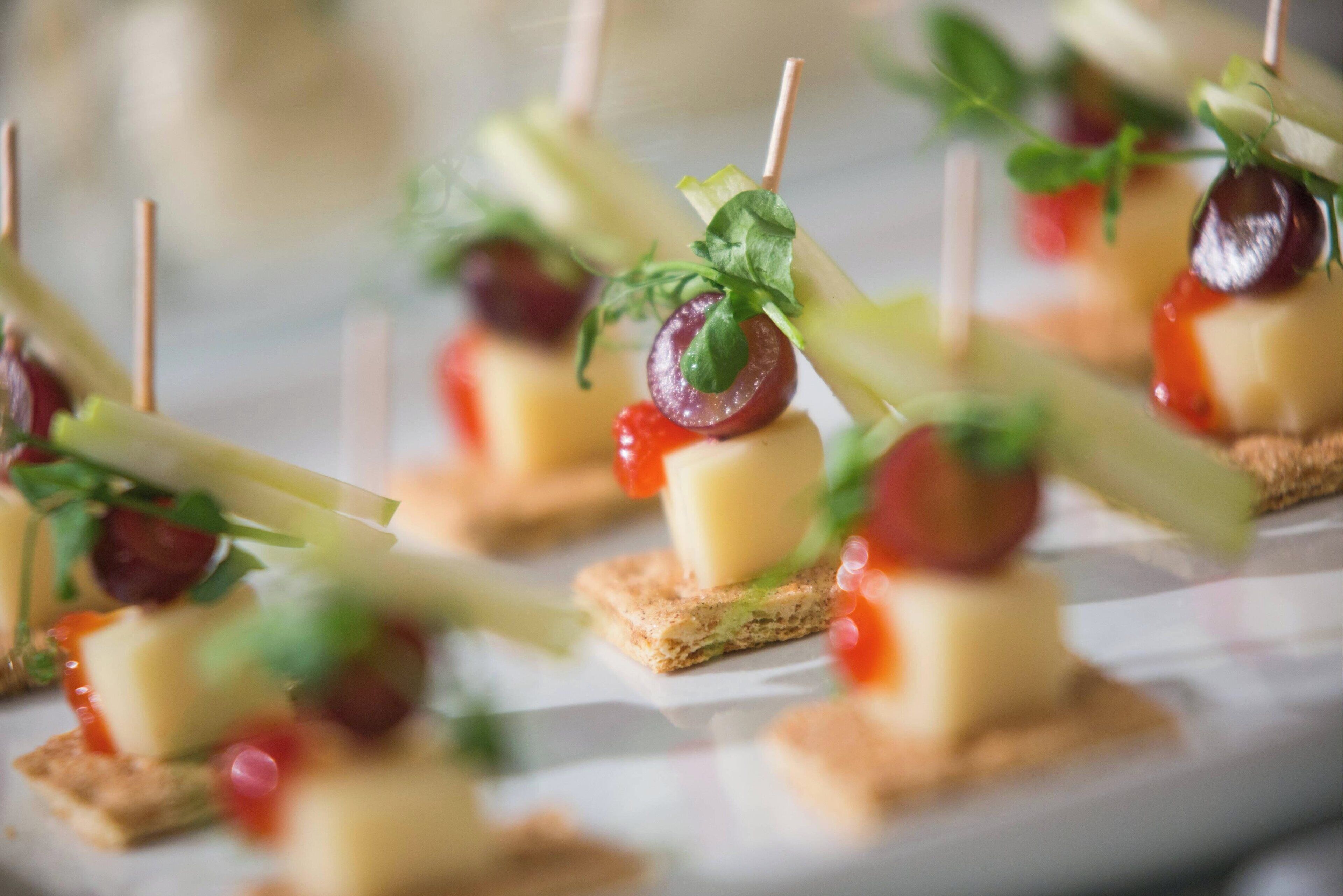 A close-up of appetizers arranged on a plate.