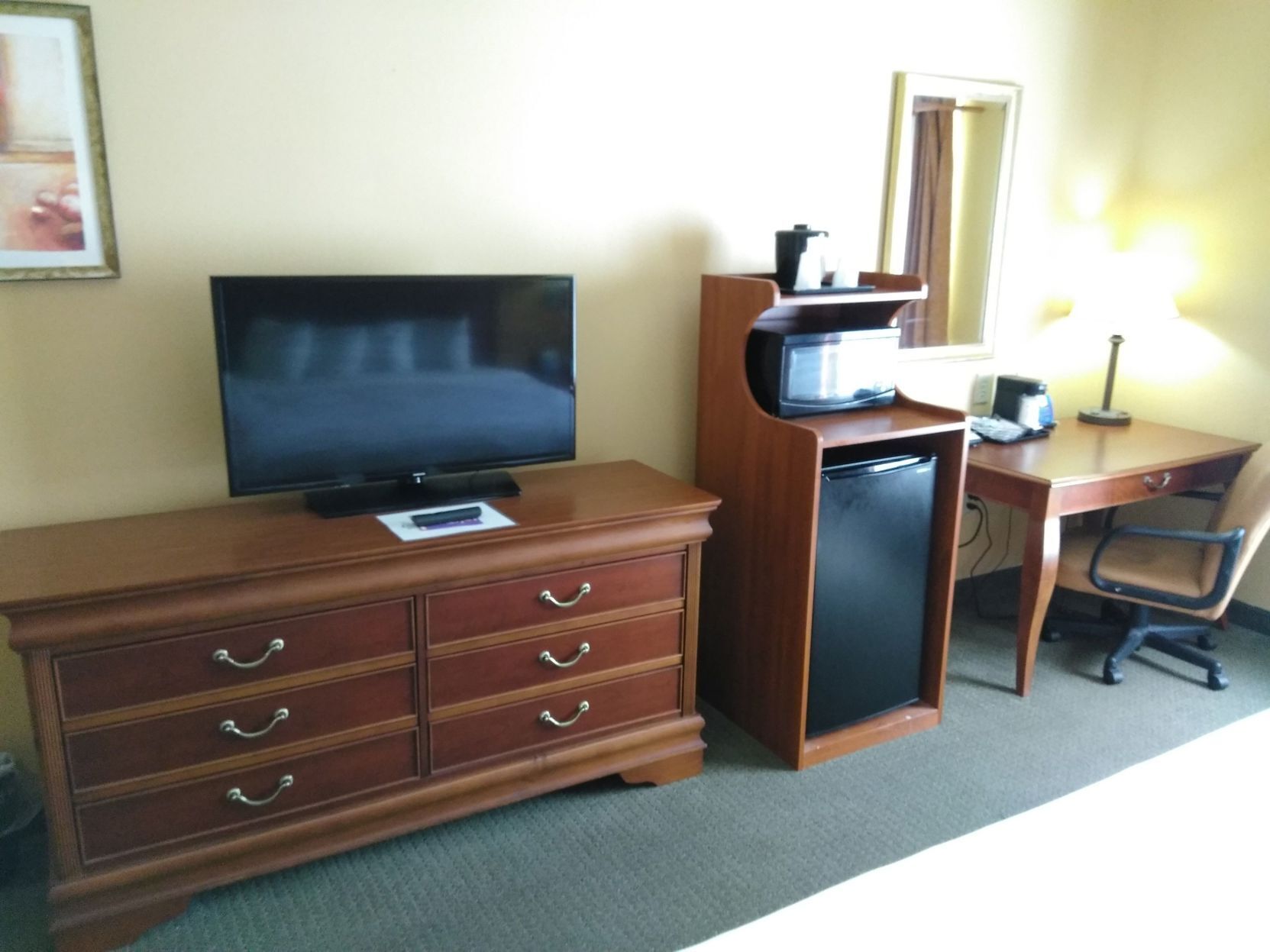 Desk, laptop workspace, iron/ironing board, free cribs/infant beds