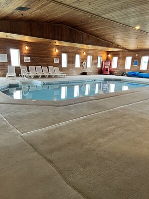 Indoor pool, open 10:00 AM to 10:00 PM, pool loungers
