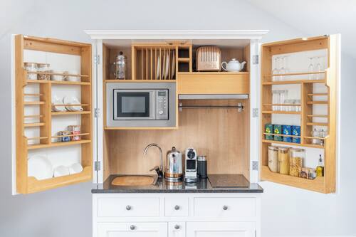 Suite Deluxe | Cucina privata | Macchina per tè/caffè, bollitore elettrico
