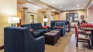 A hotel lobby with seating areas, a reception desk, and a view of the outside. - Comfort Suites Eufaula North (Eufaula)