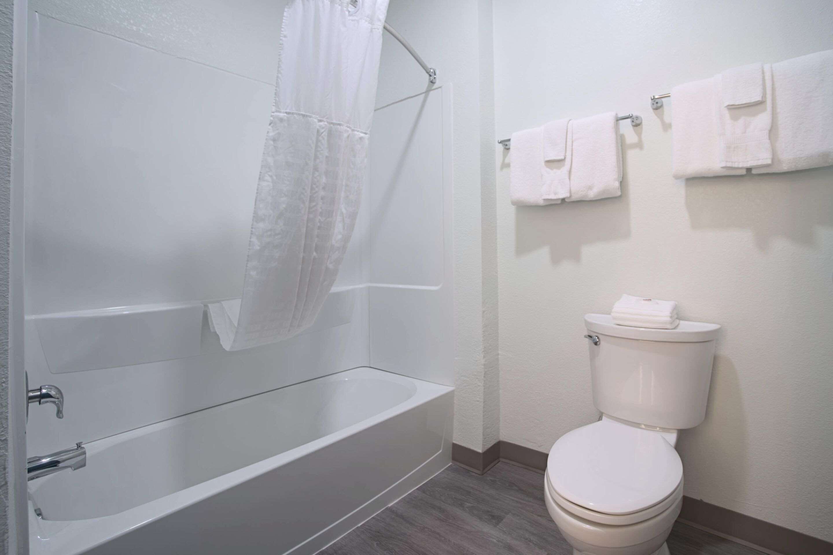 desk, laptop workspace, blackout curtains, iron/ironing board