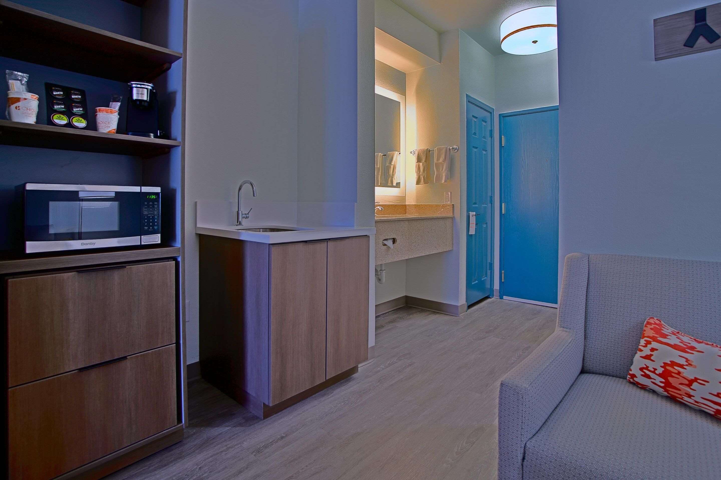 desk, laptop workspace, blackout curtains, iron/ironing board