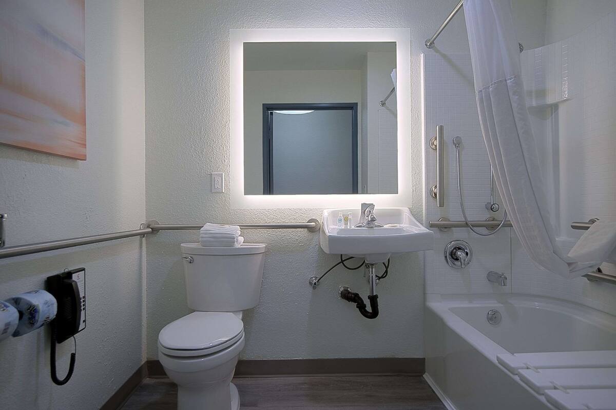 desk, laptop workspace, blackout curtains, iron/ironing board