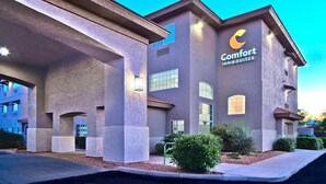 A building with a sign reading 'Comfort Inn & Suites,' featuring a modern architectural design with large windows and a flat roof. - Comfort Inn & Suites Sierra Vista Near Ft Huachuca (Sierra Vista)