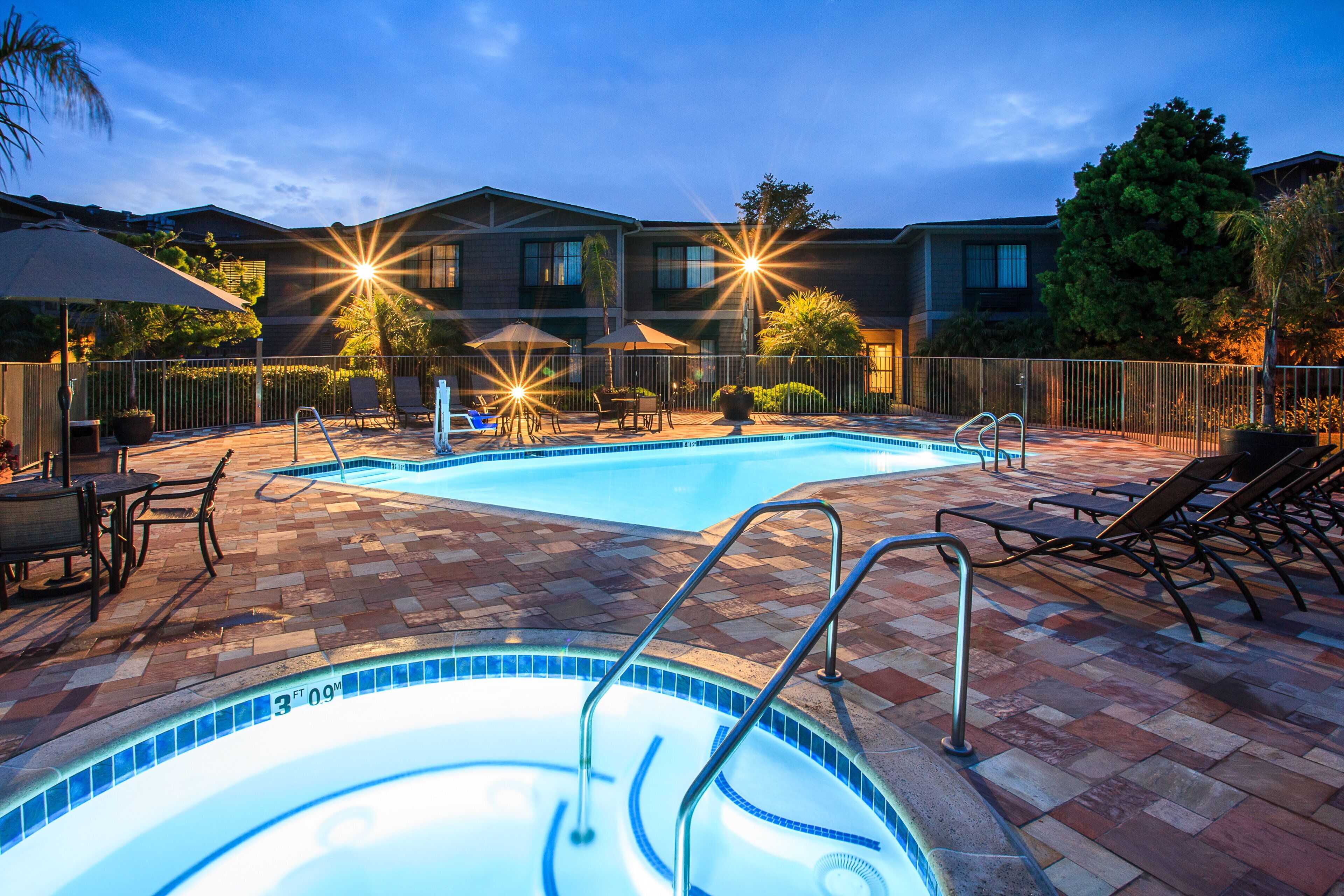 Outdoor pool, open 7 AM to 10 PM, pool umbrellas, pool loungers