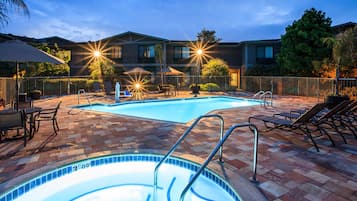 Outdoor pool, open 7 AM to 10 PM, pool umbrellas, pool loungers