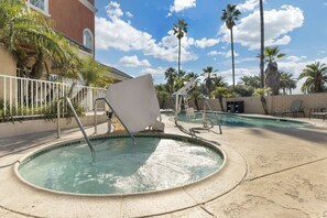 Outdoor pool, open 6:00 AM to 10:00 PM, pool umbrellas, pool loungers