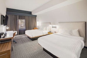 Premium bedding, desk, laptop workspace, blackout curtains
