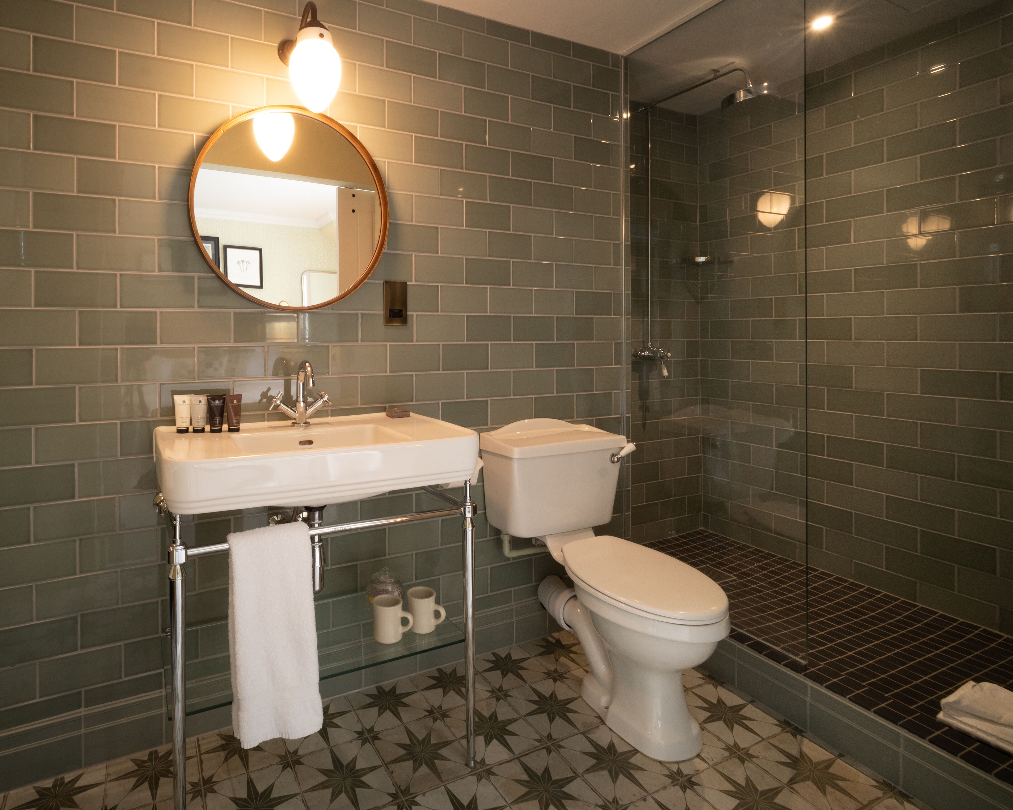 snug room | bathroom | designer toiletries, hair dryer, towels