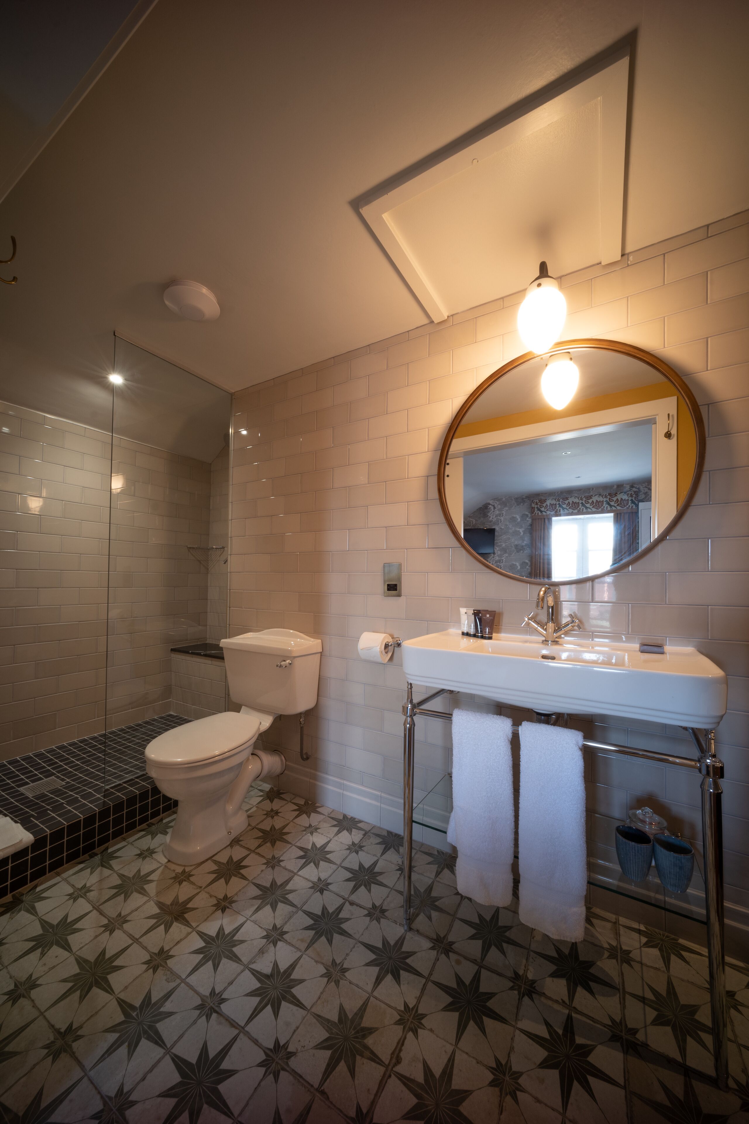 designer toiletries, hair dryer, towels