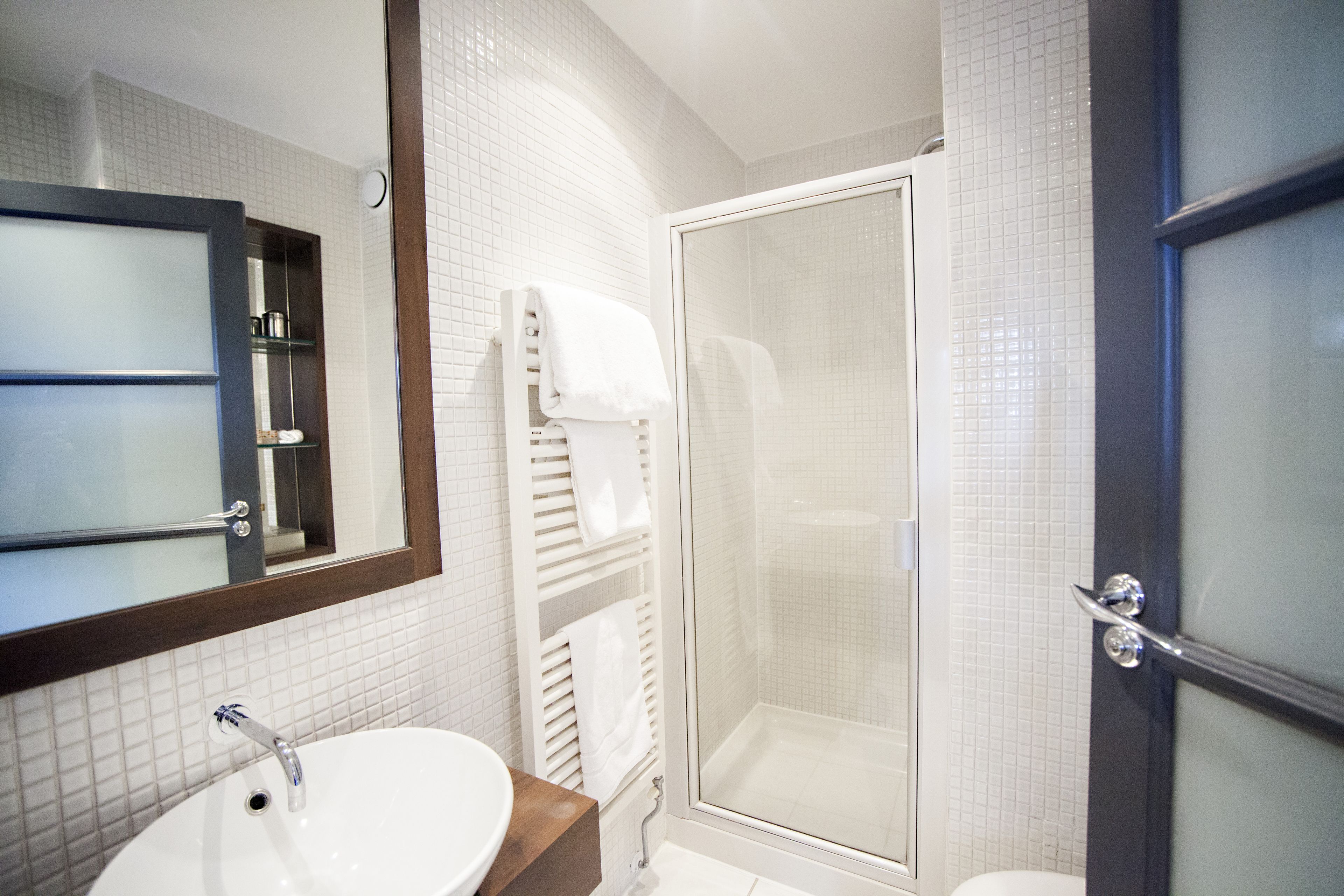 designer toiletries, hair dryer, towels, soap